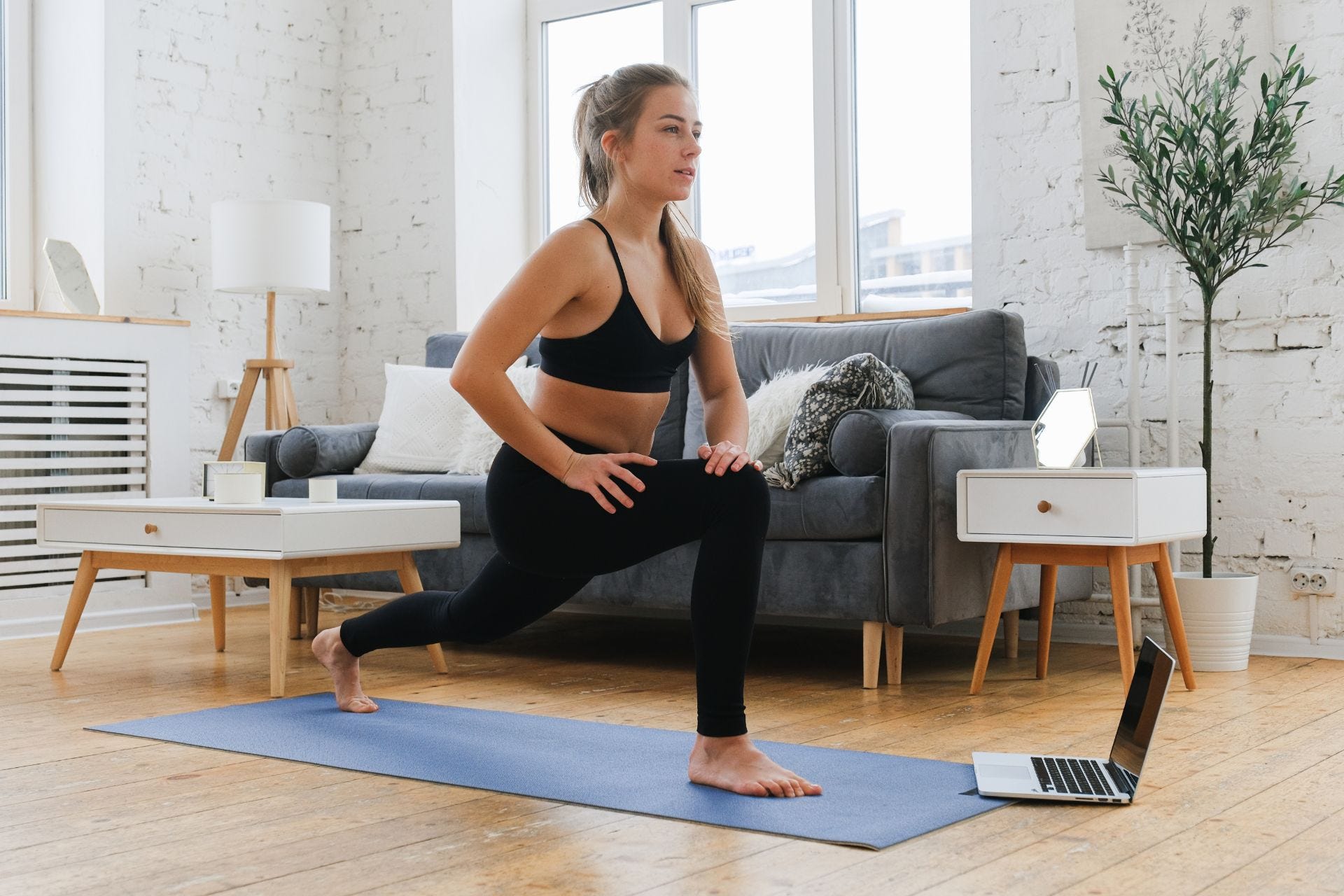 Woman excercising on a yoga mat