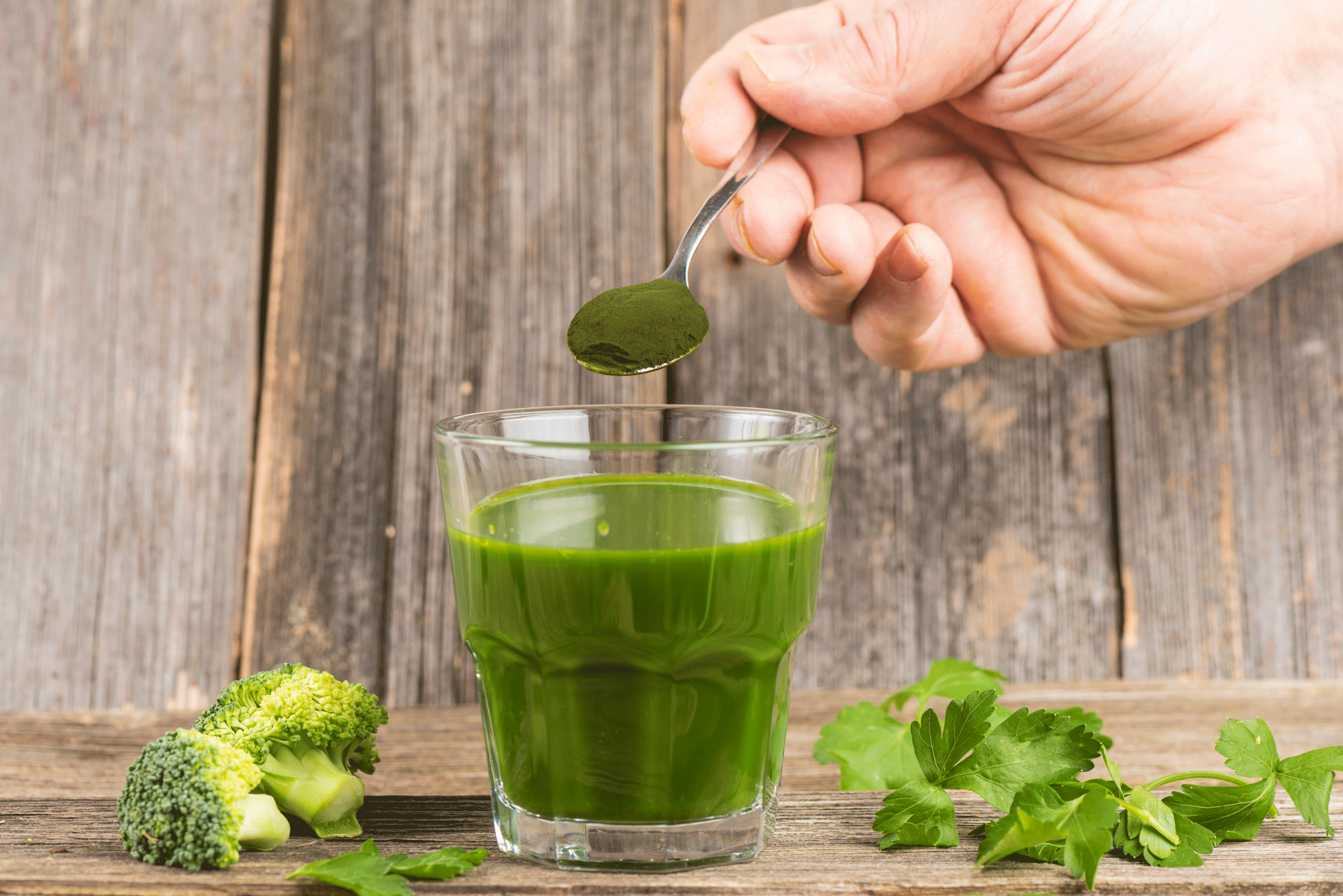 Fermented Greens powder in a glass of water